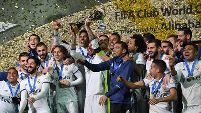 Real Madrid celebrate as captain Sergio ramos lifts the trophy after the Fifa Club World Cup final between Real Madrid and Kashima Antlers at International Stadium Yokohama on December 18, 2016 in Yokohama, Japan. Etsuo Hara/Getty Images