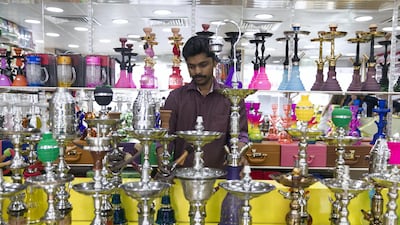 Sales have doubled in the last week at Hatta Smoking Accessories in Abu Dhabi but staff there fear that they will drop off after the exise tax is introduced. Reem Mohammed / The National