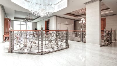 The ground floor has three open plan reception rooms with marble floors throughout and chandeliers that dazzle. Courtesy Luxhabitat