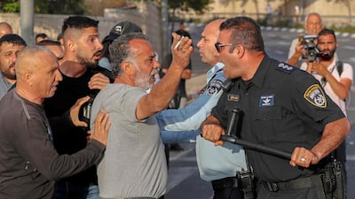 Palestinians clash with Israeli security forces during a protest condemning the killing of Abu Akleh. AFP