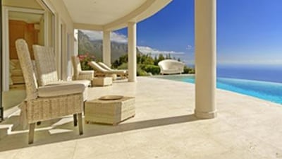 The hotel's patio overlooks the ocean.