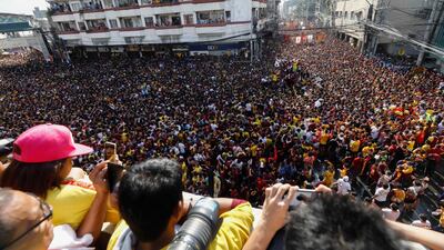 The Black Nazarene is taken on a procession as Catholic devotees flock around to mark its feast day in Manila, Philippines. EPA
