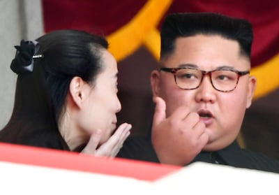 North Korean leader Kim Jong-un talks with his sister Kim Yo-jong during the parade in Pyongyang. AP