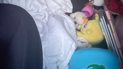 Mykhailyna gets some sleep during the journey by road from Odesa to Poland. Unicef has warned of the long-lasting impact on children’s physical and mental health of instability and fear when they leave their homes, family members, friends, toys and belongings. Photo: Alexandra Iliashenko