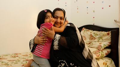 Hajera Qudoos 10 years ago, aged 6, with her mother Tahmina Qudoos. Jeffrey E Biteng / The National