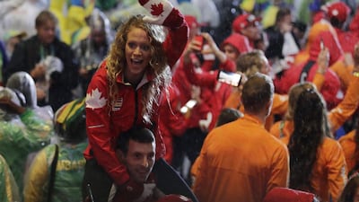 Athletes from Canada parade during the closing ceremony. Jae C Hong / AP Photo
