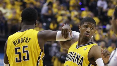 Roy Hibbert, right, and Paul George, left, of the Indiana Pacers celebrate during their win on Sunday night over the Miami Heat. Darron Cummings / AP / May 18, 2014