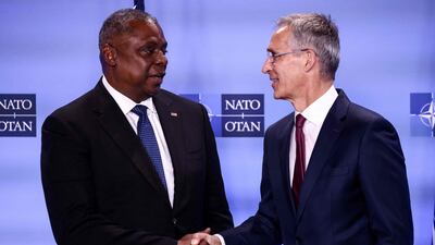 US Secretary of Defence Secretary Lloyd Austin, left, with Nato Secretary General Jens Stoltenberg at a meeting of the alliance's defence ministers at Nato headquarters in Brussels. AFP