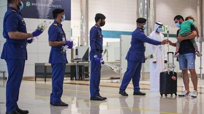 Passengers from Beirut are presented with flowers on arrival at Dubai International Airport last night. Courtesy: Dubai Customs