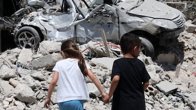 Children walk around the wreckage of Maaroub village in southern Lebanon following an Israeli air attack, which happened after the announcement of a US-Iran mediated preliminary framework to end regional military hostilities and lift the naval blockade on the Strait of Hormuz. EPA