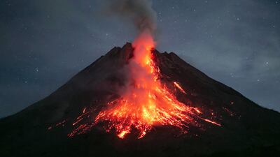 Indonesia's Mount Merapi, one of the world's most active volcanoes, spews lava during an eruption as seen from Dadap Ngori hamlet in Magelang on May 23, 2023. (Photo by DEVI RAHMAN / AFP)