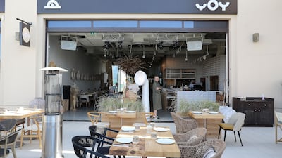 Yoy has plenty reminders of home, such as a 13-metre-long table made of Ukrainian wood decorated with a giant, hand-woven stork’s nest