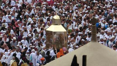 Pilgrims pray near Maqam Ibrahim, or the Station of Abraham, the golden glass structure, center, at the Grand Mosque in Mecca. AP Photo