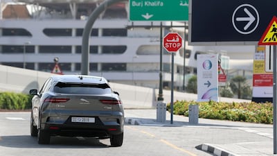 A Jaguar iPace autonomous vehicle takes people on a drive to show driverless cars at work. Chris Whiteoak / The National
