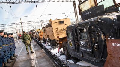 Russian soldiers stand next to a U.S. made armored personnel carrier. AP Photo