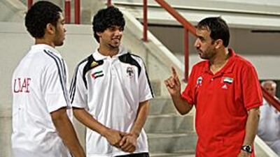 The UAE Under 17 coach Ali Ibrahim, right, speaks to his players Hassan Yousuf, left, and Mohammed Abdullah.