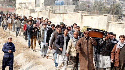 Afghan men carry the coffin of one of the 103 victims of the bombing in Kabul on January 28, 2018, a day after the attack claimed by the Taliban. Omar Sobhani / Reuters