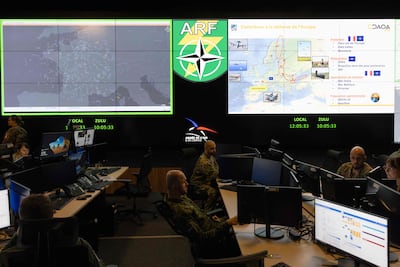 Military personnel monitor air operations at a base in Lyon, France. AFP