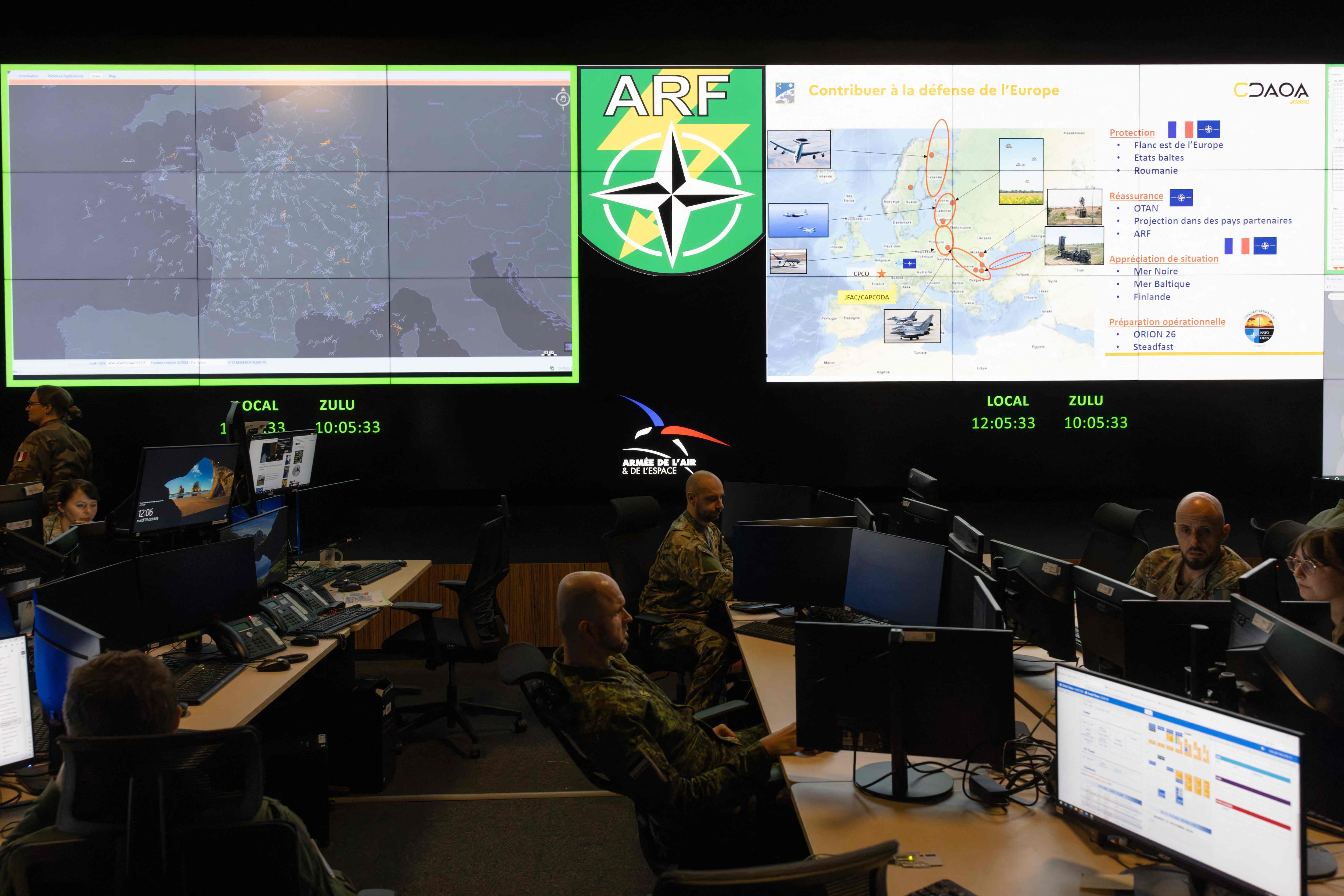 Military personnel monitor air operations at a base in Lyon, France. AFP