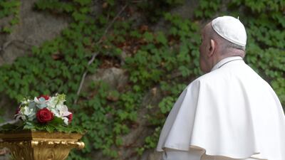 Pope Francis leads a prayer in the Vatican gardens on Saturday. Reuters