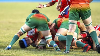 Dubai Knights Eagles take on Dubai Tigers, in red, in the West Asia Premiership at Dubai Sports City on Friday. The Tigers won 27-16. All photos by Victor Besa / The National