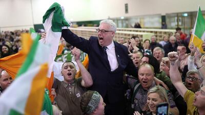 Thomas Gould of Sinn Fein tops the poll and is elected in Cork North Central, during the Irish General Election count at the Nemo Rangers GAA Club in Cork, Ireland. PA via AP