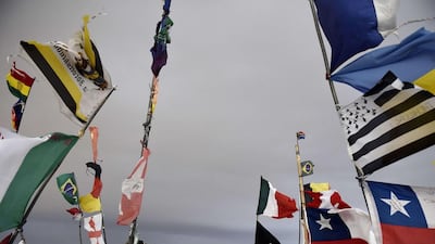Dakar rally director Etienne Lavigne and staff members ride through Bolivia, near the Andes, at the Salar de Uyuni salt pan as they scout out locations for the 2015 Dakar Rally. Franck Fife / AFP / September 18, 2014