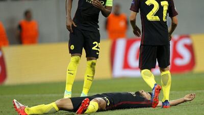Sergio Aguero (down) reacts after scoring a hat trick. (EPA)