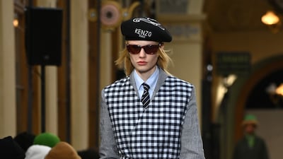 In a nod to Japanese culture, a suit is worn under a gingham apron.