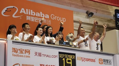 Alibaba employees attend the opening bell ceremony during the company’s IPO at the New York Stock Exchange. Mark Lennihan / AP Photo