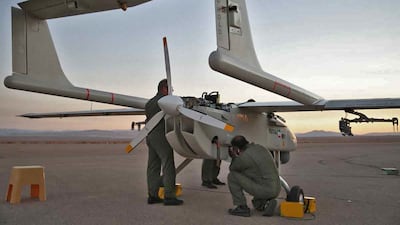 Technicians check an aerial vehicle. AFP