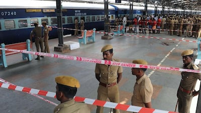 Indian police stand guard at the Chennai train station after two bombs went off in a train arriving from Bangalore on Thursday morning, killing one person and injuring nine others. AFP / May 1, 2014