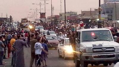 June 11, 2014: Militants parading down a main road in Mosul, posted on a militant Twitter account. AP Photo