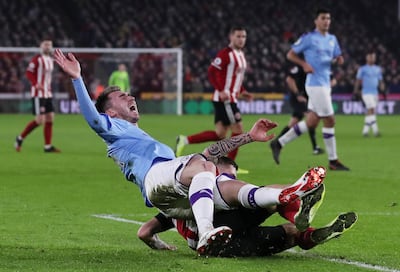 Aymeric Laporte gave Manchester City a scare when he went down injured after a challenge by Muhamed Besic that earned the Sheffield United player a yellow card. Reuters