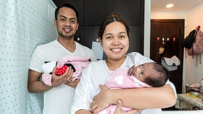 Parents John and Monica Pentio Tubo are delighted to finally have their twin daughters home. All pictures by Antonie Robertson/The National