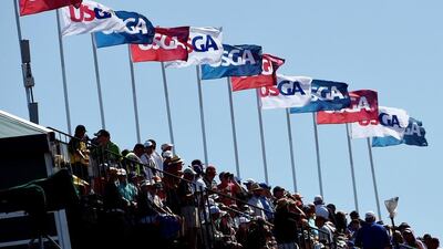 Fans watch the play during the third round. Ross Kinnaird / Getty Images / June 20, 2015