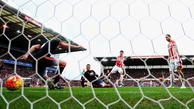 Bojan Krkic of Stoke City scores the opening goal past Chris Smalling and Phil Jones of Manchester United on Saturday in their Premier League contest. Laurence Griffiths / Getty Images