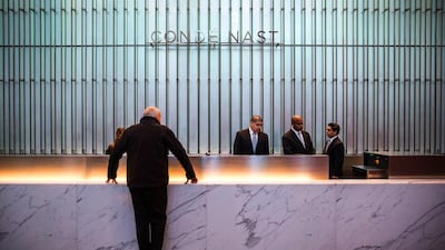A man checks in to the front desk. The building is the third tallest in the world. Andrew Burton / Getty Images / AFP