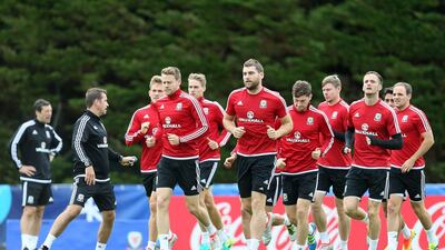 Welsh players warm up during a training session of the Welsh national soccer team, in Dinard, France, Monday, July 4, 2016. Wales will face Portugal in a Euro 2016 semifinal match at the Grand Stade in Decines-Charpieu, near Lyon, France, Wednesday, July 6, 2016.(AP Photo/Vincent Michel)