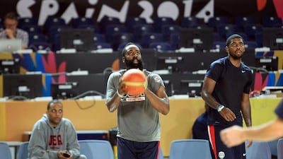 James Harden, centre, and Kyrie Irving, right, will try and make up for the absence of some illustrious compatriots in the sport at the World Cup in Spain. Luis Tejido / EPA