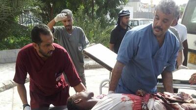 A survivor from a suicide bomb attack against army recruits in Aden on 29 August, 2016 arrives at hospital for treatment. The bomb, which was claimed by ISIL, killed 74 people. Mohammed Al Qalisi for The National