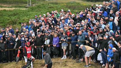 Tiger Woods plays from the rough on the 12th hole. AFP