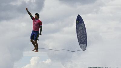 Brazil's Gabriel Medina reacts after getting a large wave in the 5th heat of the men's surfing round 3. AFP