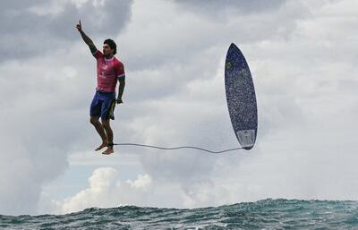 Brazil's Gabriel Medina hangs in mid-air in the 5th heat of the men's surfing round 3, in Teahupo'o on the French Polynesian Island of Tahiti. AFP