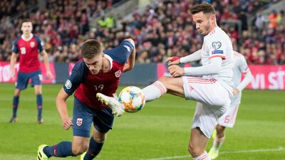 Norway's Markus Henriksen, left, fights for the ball against Spain's Sergio Ramos, right, during the UEFA Euro 2020 qualifying Group F soccer match between Norway and Spain at Ullevaal Stadium in Oslo, Norway. AP