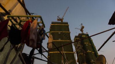 But the pace of rooftop removals is now outstripping the ability to rehouse due to a lack of coordination between the buildings and housing departments. Anthony Wallace/AFP Photo