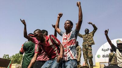 In this April 11, 2019 file photo, Sudanese in Khartoum, Sudan celebrate after President Omar al-Bashir was overthrown. AP