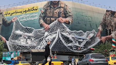 A giant billboard reading 'The Strait of Hormuz remains closed' at Revolution Square in Tehran on April 28. AFP