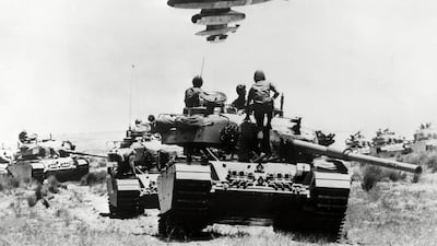 A mirage "Vautour" flying over Israeli soldiers sitting o tanks in the the Sinai peninsula on the Israel-Egypt border during the six days in 1967. AFP