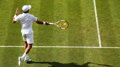 Detail shot of the shadow as Jan Hernych of Czech Republic plays a forehand shot during his singles match against Roberto Bautista Agut on Wednesday in the second round of the 2014 Wimbledon Championships. Bautista Agut won the match in four sets. Dan Kitwood / Getty Images